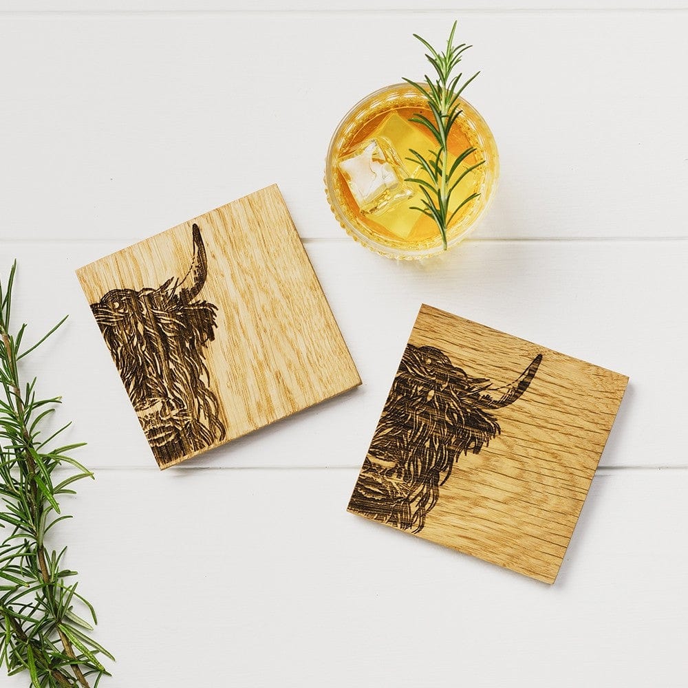 In this photo 2 Oak Coasters Highland Cow Mood4Whisky